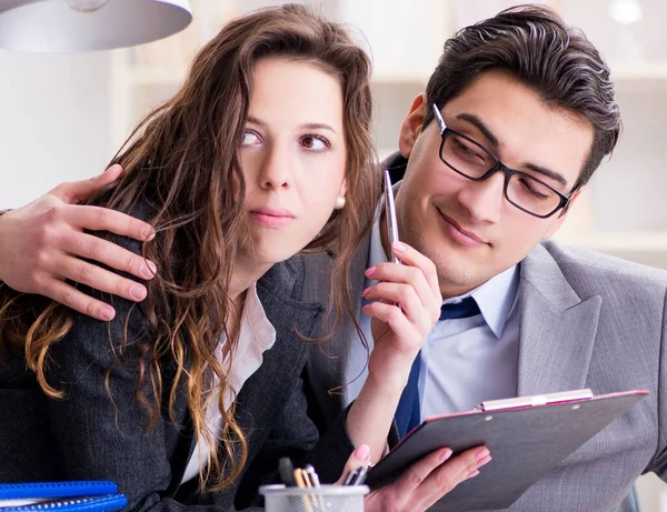 Sexual harassment concept with man and woman in office — Stock Photo, Image