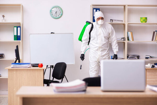 Contractor disinfecting office for COVID-19 coronavirus