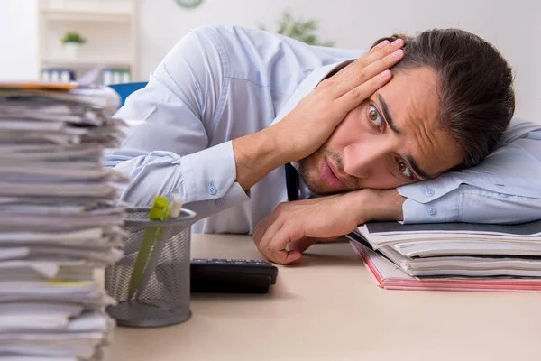 Young male businessman employee unhappy with excessive work — Stock Photo, Image