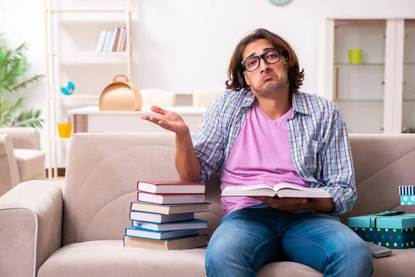 Young male student preparing for exams during Christmas — Φωτογραφία Αρχείου