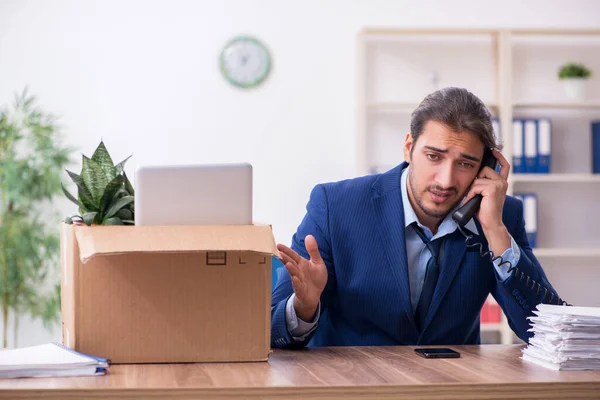 Young man being fired from his work