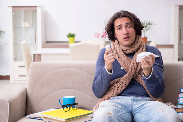 Sick male student suffering at home