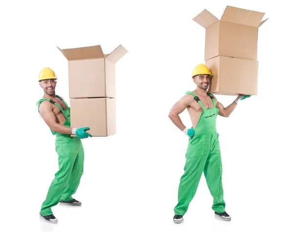 Hombre en mono verde con cajas — Foto de Stock