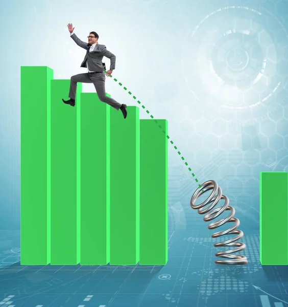 Business people jumping over bar charts — Stock Photo, Image