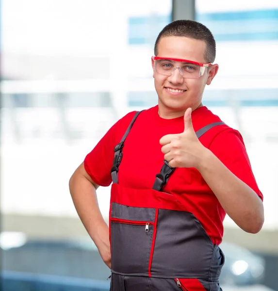 Young furniture carpenter in industrial concept — Stock Photo, Image