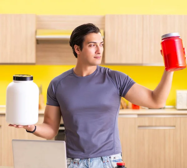 Young man blogging about food supplements — Stock Photo, Image