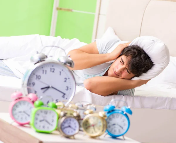 Young man having trouble waking up in early morning — Stock Photo, Image