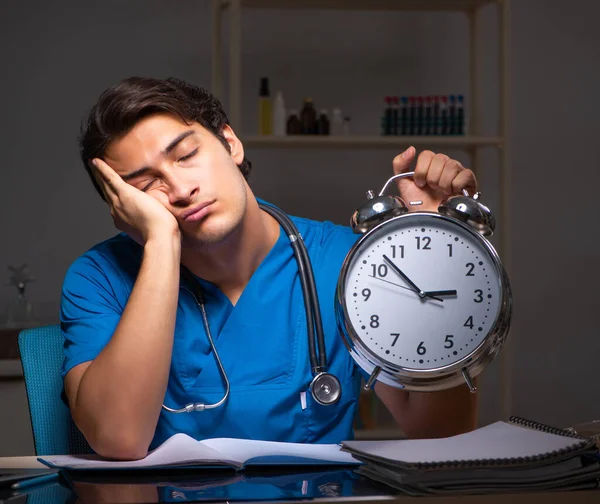 Young handsome doctor working night shift in hospital — Stock Photo, Image