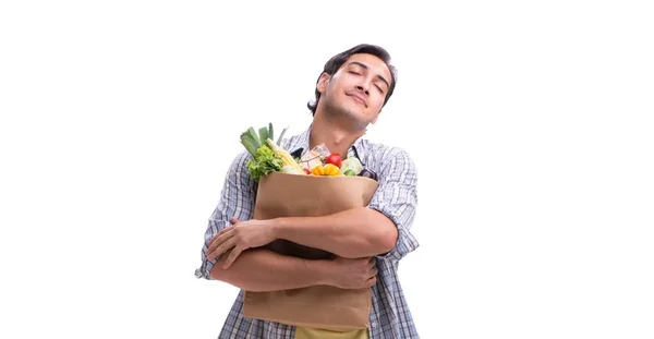 Junger Mann mit seinem Einkauf in Weiß — Stockfoto