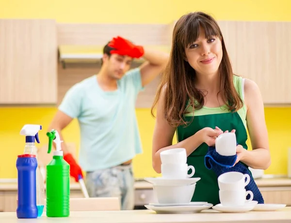 Young couple working at kitchen — Stock Photo, Image