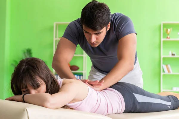 Young doctor chiropractor massaging patient — Stock Photo, Image