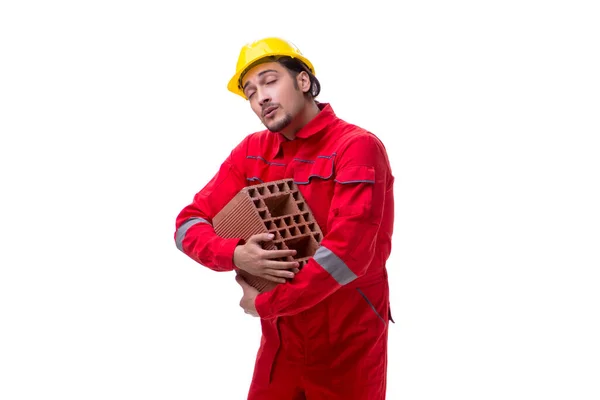 Jonge mannelijke metselaar met baksteen geïsoleerd op wit — Stockfoto