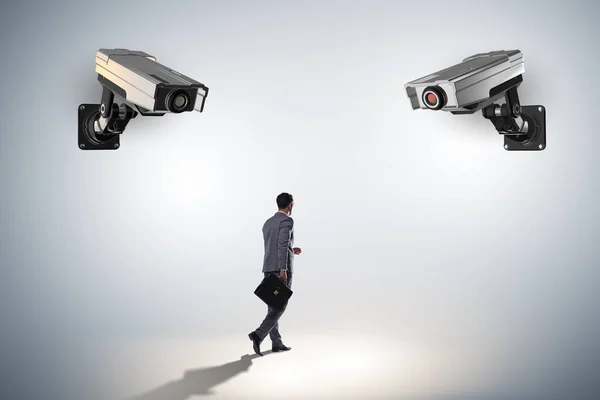 Cameras wathing man in spying concept — Stock Photo, Image