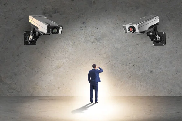 Cameras wathing man in spying concept — Stock Photo, Image