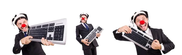 与键盘上白色孤立的滑稽小丑 — 图库照片