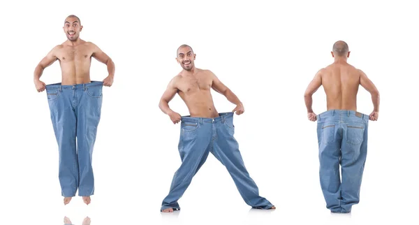 Człowiek w diety koncepcja z ponadgabarytowych dżinsy — Zdjęcie stockowe