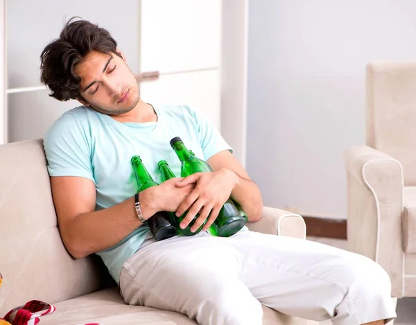 Young drunk handsome man after party at home — Stock Photo, Image