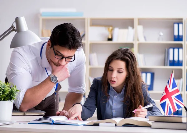 Teacher explaining to student at language training — Stock Photo, Image