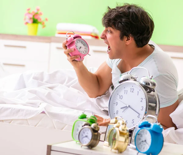 Young man having trouble waking up in early morning — Stock Photo, Image