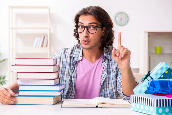 Young male student preparing for exams during Christmas — 图库照片