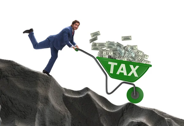 Businessman pushing wheelbarrow with tax money — Stock Photo, Image