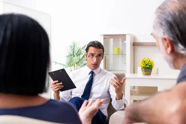 Old couple visiting psychiatrist doctor