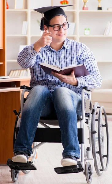 The disabled student studying at home on wheelchair