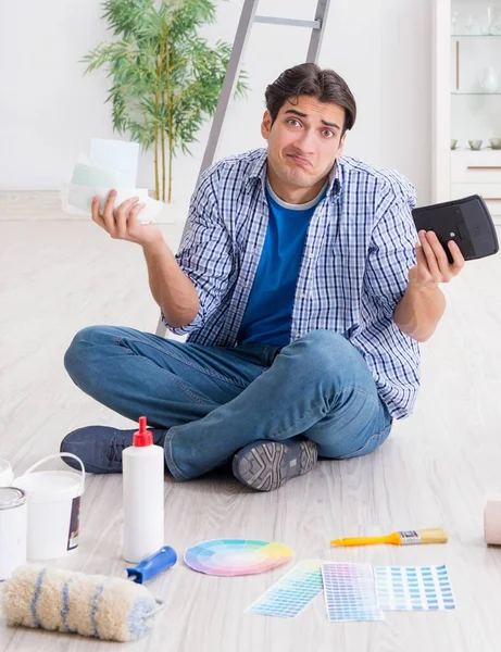 The young man overspending his budget in refurbishment project — Stock Photo, Image