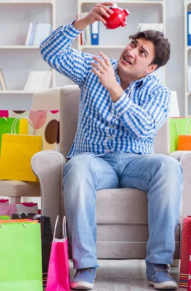 Young man after excessive shopping at home — Stock Photo, Image