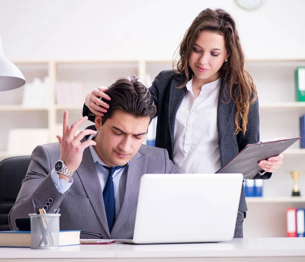 Sexual harassment concept with man and woman in office — Stock Photo, Image