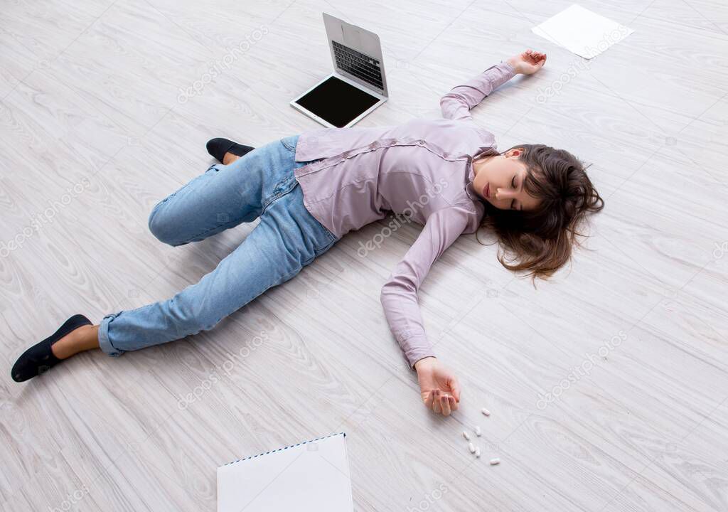 Dead woman on the floor after commiting suicide