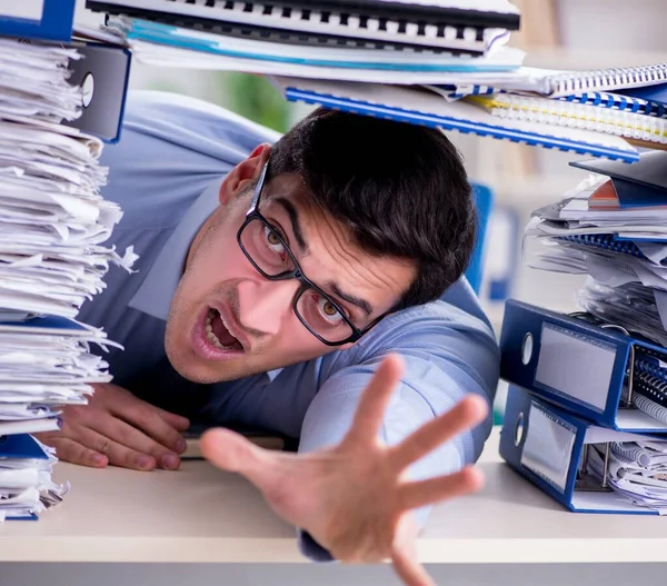 Extremely busy businessman working in office — Stock Photo, Image
