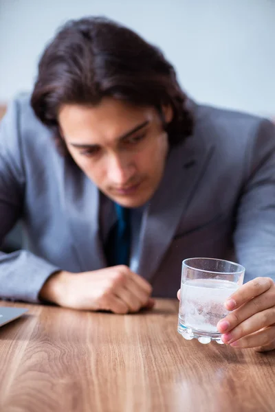 Sick male employee suffering in the office — Stock Photo, Image