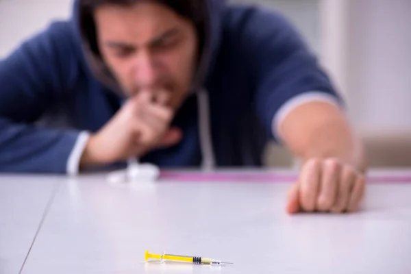 Young man having problems with narcotics at home — Stock Photo, Image