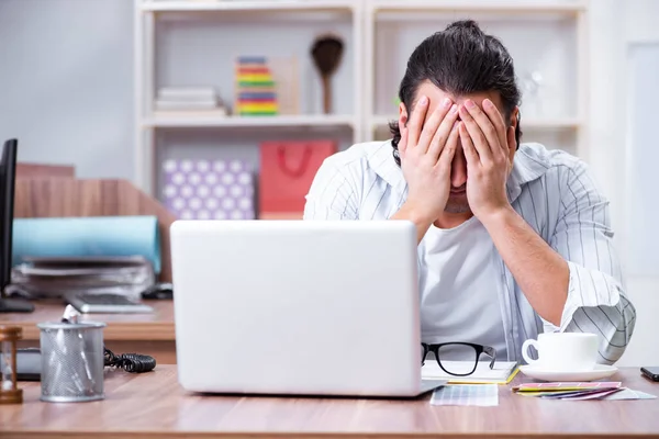 Young male designer working in the office — Stock Photo, Image