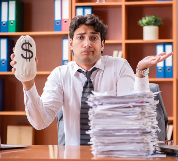 Young handsome businessman unhappy with excessive work Stock Image