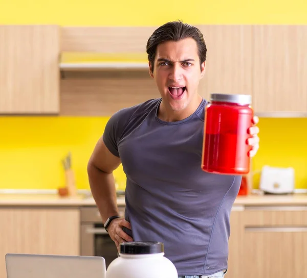 Young man blogging about food supplements — Stock Photo, Image