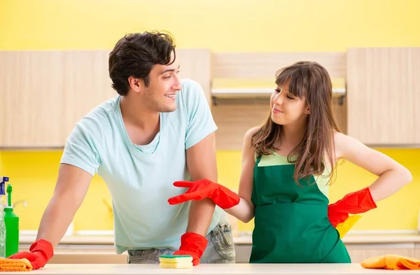 Young couple working at kitchen — Stock Photo, Image