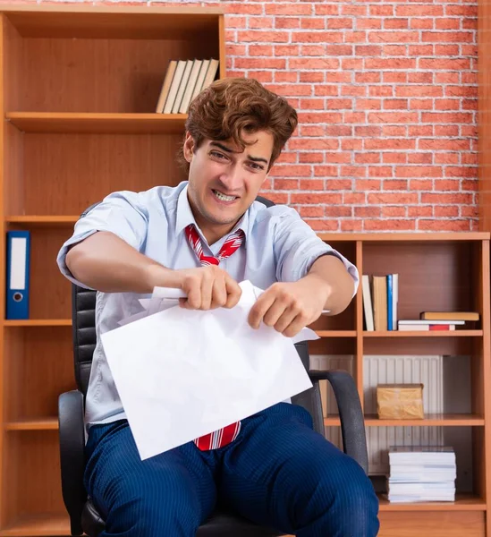 Unhappy businessman sitting in the office — Stock Photo, Image