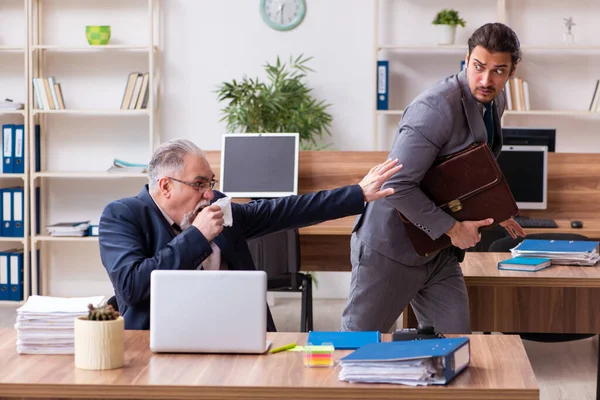 Two employees in pandemic concept at workplace — Stock Photo, Image