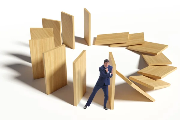 Empresário no conceito de efeito dominó — Fotografia de Stock