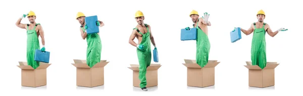 Homem de macacão com caixas — Fotografia de Stock