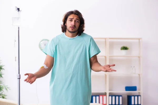 Young male patient in blood transfusion concept — Stock Photo, Image