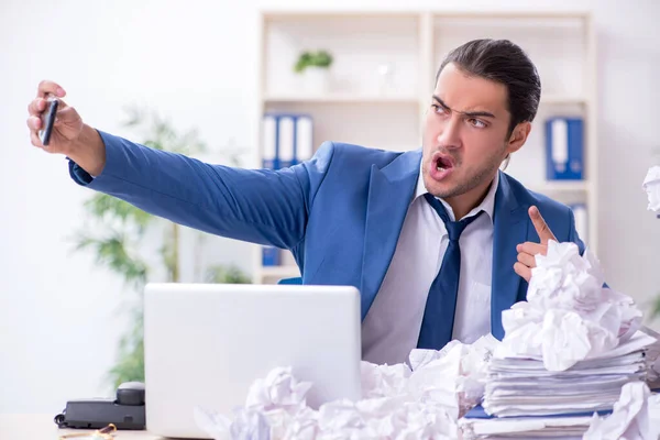 Businessman rejecting new ideas with lots of papers — Stock Photo, Image
