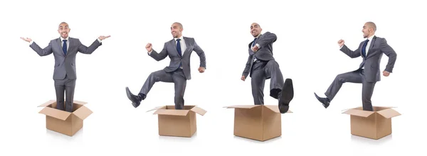 Businessman with box isolated on the white — Stock Photo, Image