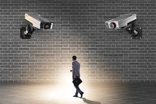 Cameras wathing man in spying concept — Stock Photo, Image