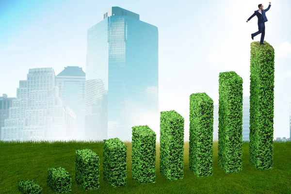 Businessman in green ecology growth concept