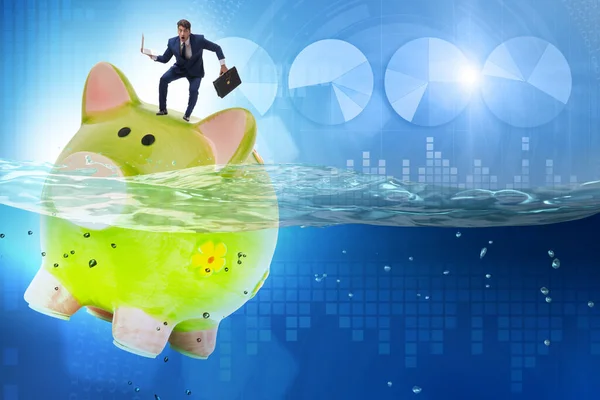 Businessman in debt concept with piggybank — Stock Photo, Image