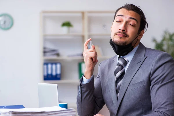 Young male employee in self-quarantine concept — Stock Photo, Image