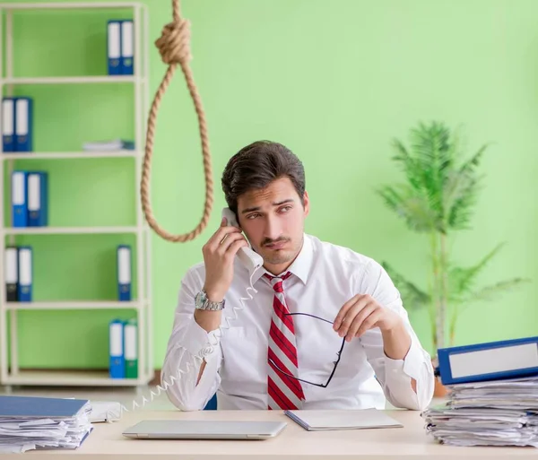 Despaired businessman thinking of suicide in the office — Stock Photo, Image